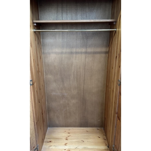 116 - A pine double wardrobe with later added top - approx. 220cm high x 85cm wide x 55cm deep