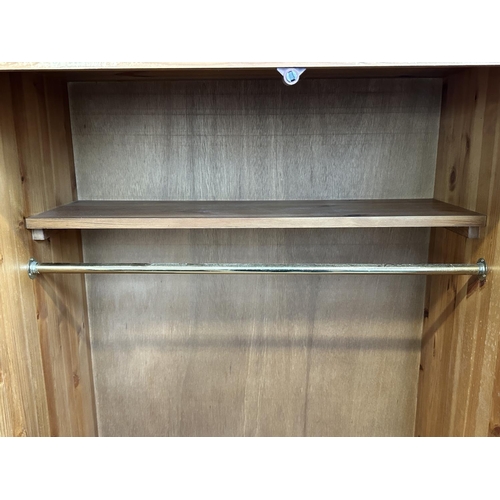 116 - A pine double wardrobe with later added top - approx. 220cm high x 85cm wide x 55cm deep