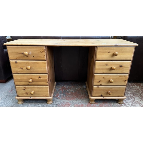117 - A pine dressing table - approx. 74cm high x 132cm wide x 38cm deep