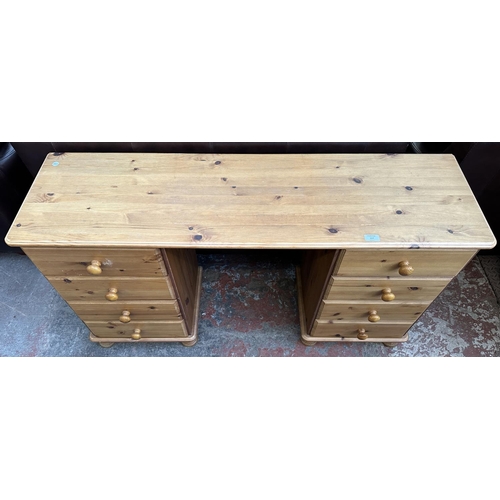 117 - A pine dressing table - approx. 74cm high x 132cm wide x 38cm deep
