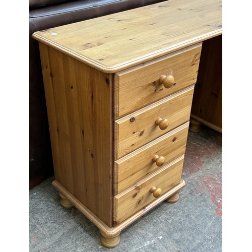 117 - A pine dressing table - approx. 74cm high x 132cm wide x 38cm deep