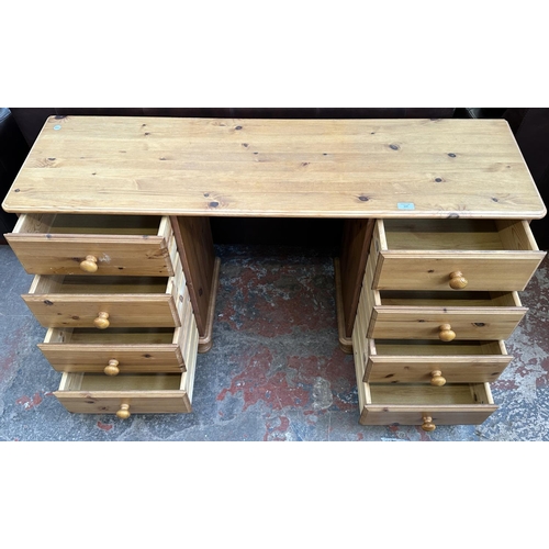117 - A pine dressing table - approx. 74cm high x 132cm wide x 38cm deep