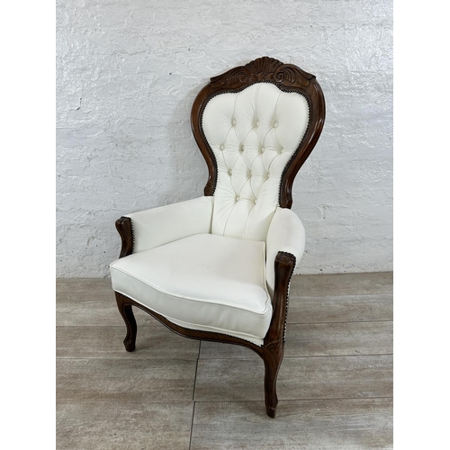 127 - A Victorian style carved beech and white faux leather spoon back armchair - approx. 109cm high x 70c... 