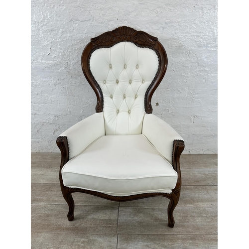 127 - A Victorian style carved beech and white faux leather spoon back armchair - approx. 109cm high x 70c... 