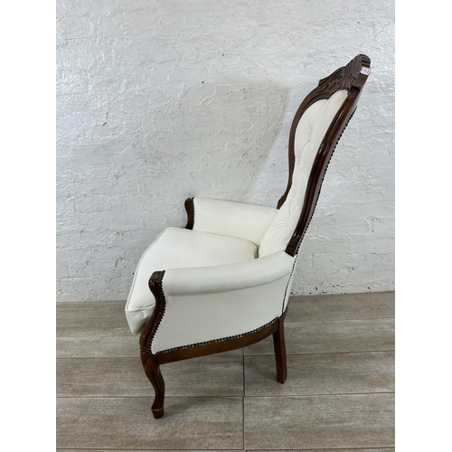 127 - A Victorian style carved beech and white faux leather spoon back armchair - approx. 109cm high x 70c... 