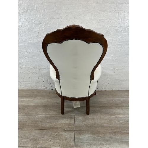 127 - A Victorian style carved beech and white faux leather spoon back armchair - approx. 109cm high x 70c... 