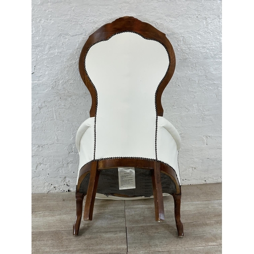 127 - A Victorian style carved beech and white faux leather spoon back armchair - approx. 109cm high x 70c... 