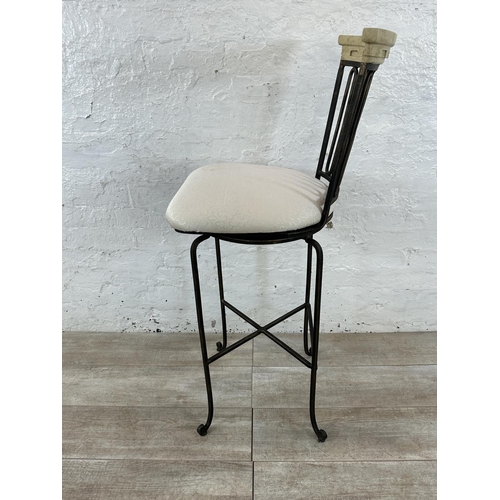 128 - A wrought metal and marble effect swivel bar stool - approx. 112cm high