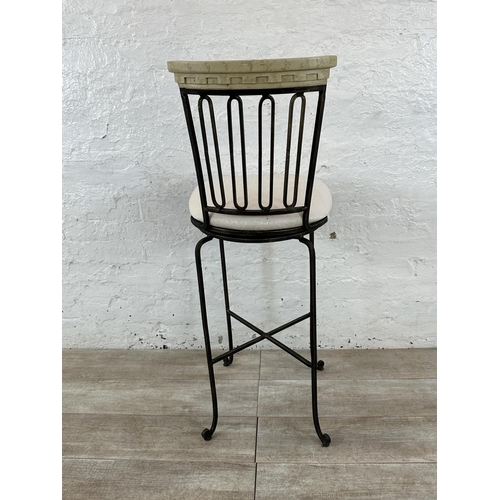 128 - A wrought metal and marble effect swivel bar stool - approx. 112cm high