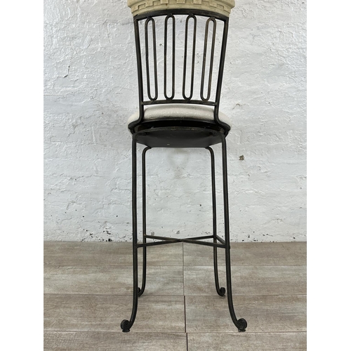 128 - A wrought metal and marble effect swivel bar stool - approx. 112cm high