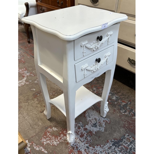 135 - A French style white painted serpentine two drawer bedside table - approx. 76cm high x 39cm wide x 3... 