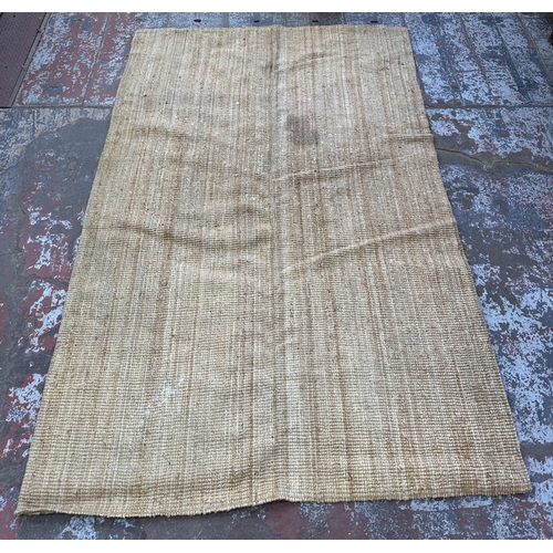 138 - A modern natural fibre rug - approx. 298cm x 197cm