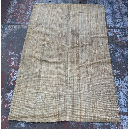 138 - A modern natural fibre rug - approx. 298cm x 197cm