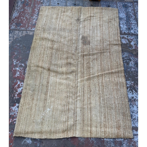 138 - A modern natural fibre rug - approx. 298cm x 197cm