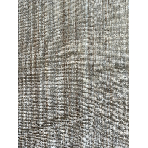 138 - A modern natural fibre rug - approx. 298cm x 197cm