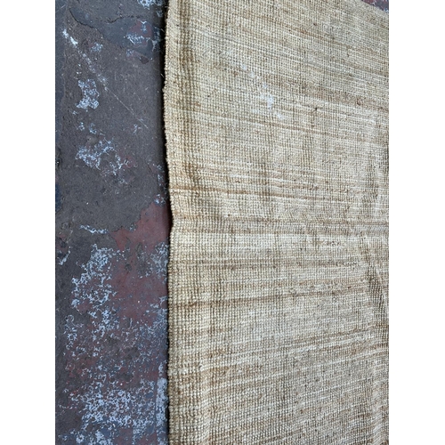 138 - A modern natural fibre rug - approx. 298cm x 197cm