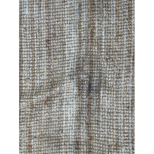 138 - A modern natural fibre rug - approx. 298cm x 197cm