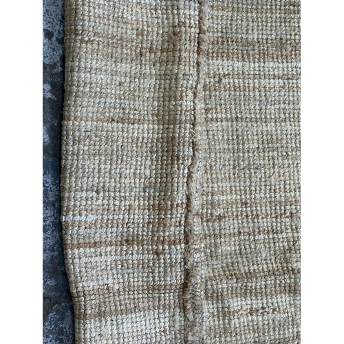 138 - A modern natural fibre rug - approx. 298cm x 197cm