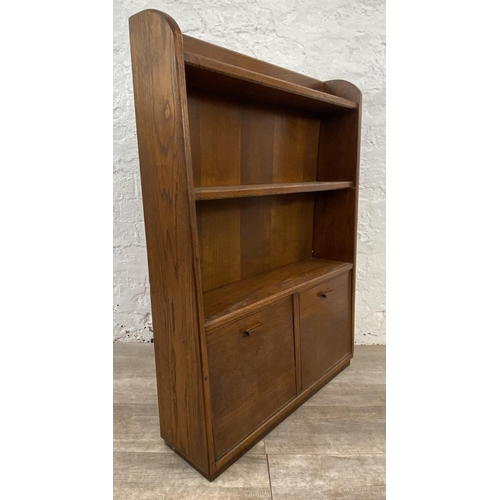 139 - A mid 20th century oak three tier bookcase - approx. 97cm high x 74cm wide x 20cm deep