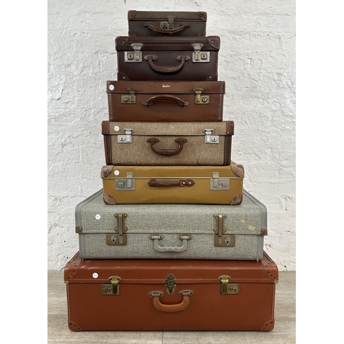 14 - Seven mid 20th century travel trunks - largest approx. 26cm high x 77cm wide x 50cm deep