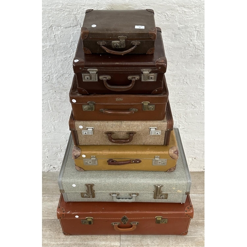 14 - Seven mid 20th century travel trunks - largest approx. 26cm high x 77cm wide x 50cm deep