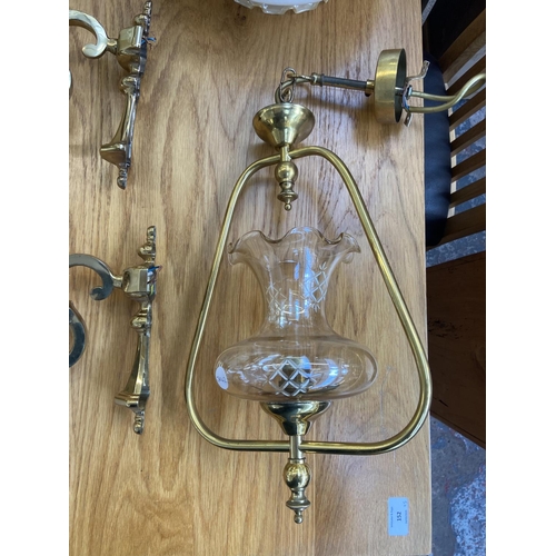 153 - Eleven pieces of lighting to include Art Deco style glass and brass effect shell shaped wall lights,... 