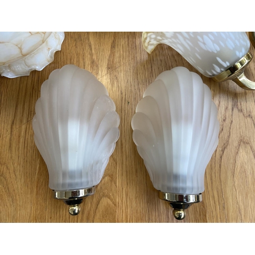 153 - Eleven pieces of lighting to include Art Deco style glass and brass effect shell shaped wall lights,... 