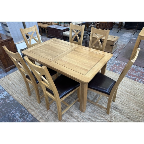 154 - A modern oak extending dining table and six chairs - approx. 77cm high x 90cm wide x 150cm long