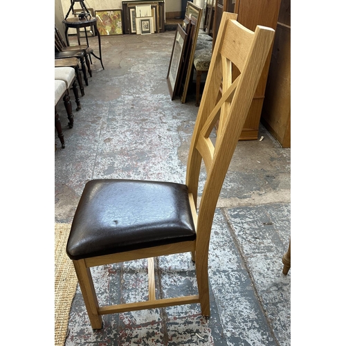 154 - A modern oak extending dining table and six chairs - approx. 77cm high x 90cm wide x 150cm long