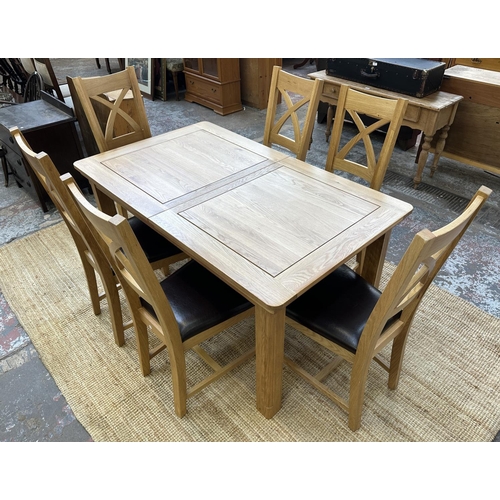 154 - A modern oak extending dining table and six chairs - approx. 77cm high x 90cm wide x 150cm long