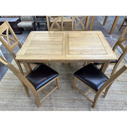 154 - A modern oak extending dining table and six chairs - approx. 77cm high x 90cm wide x 150cm long