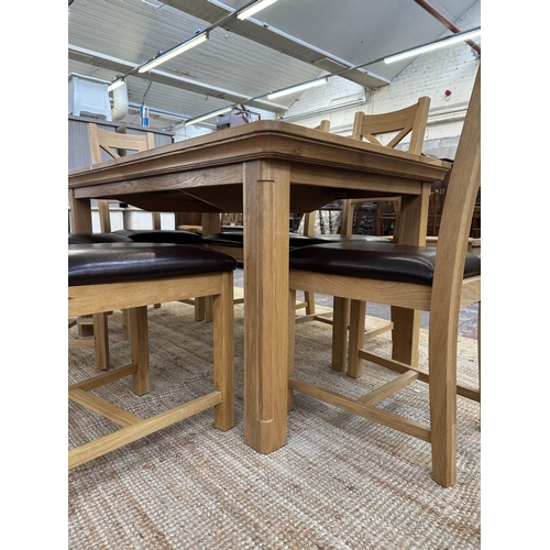 154 - A modern oak extending dining table and six chairs - approx. 77cm high x 90cm wide x 150cm long