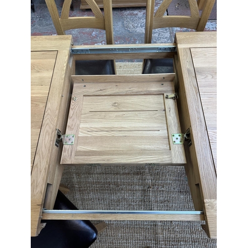 154 - A modern oak extending dining table and six chairs - approx. 77cm high x 90cm wide x 150cm long