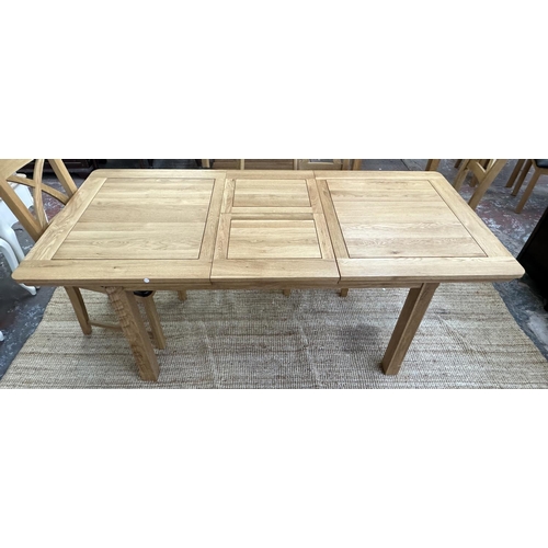 154 - A modern oak extending dining table and six chairs - approx. 77cm high x 90cm wide x 150cm long