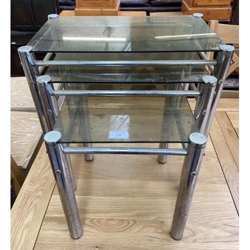 156 - An Italian smoked glass and chrome plated nest of three tables - approx. 47cm high x 52cm wide x 32c... 