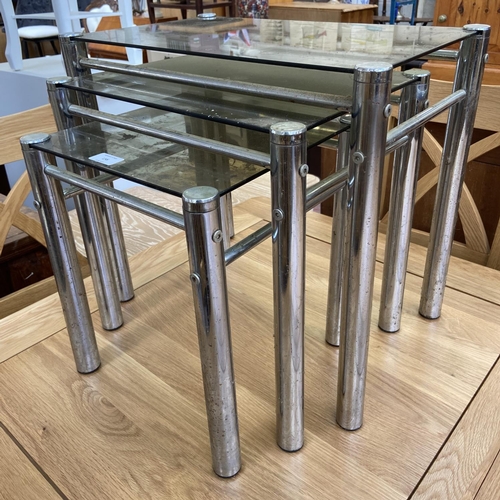 156 - An Italian smoked glass and chrome plated nest of three tables - approx. 47cm high x 52cm wide x 32c... 