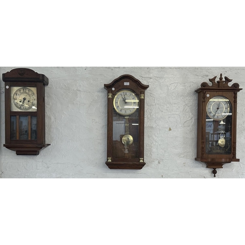 17 - Three wall clocks, one early 20th century mahogany cased chiming with key and pendulum, one Emperor ... 