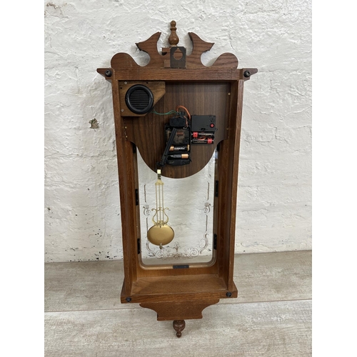 17 - Three wall clocks, one early 20th century mahogany cased chiming with key and pendulum, one Emperor ... 