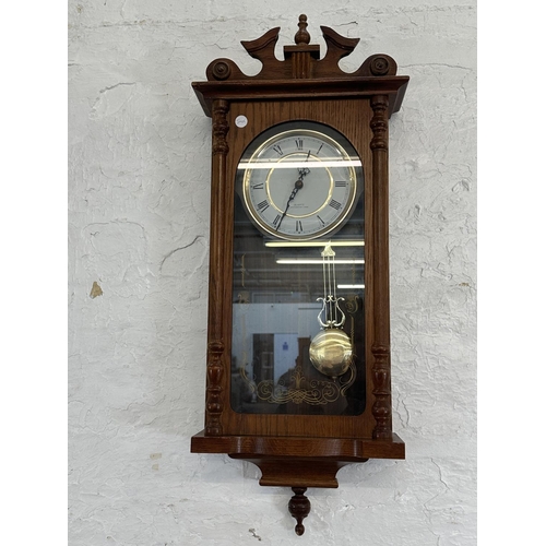 17 - Three wall clocks, one early 20th century mahogany cased chiming with key and pendulum, one Emperor ... 