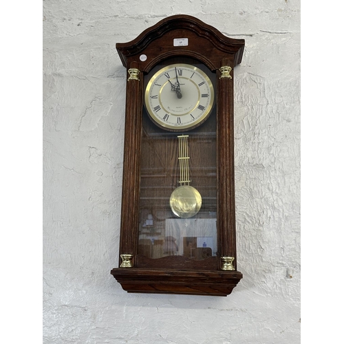 17 - Three wall clocks, one early 20th century mahogany cased chiming with key and pendulum, one Emperor ... 