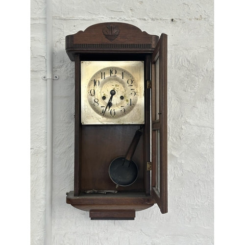 17 - Three wall clocks, one early 20th century mahogany cased chiming with key and pendulum, one Emperor ... 