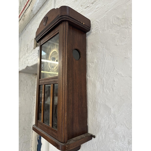 17 - Three wall clocks, one early 20th century mahogany cased chiming with key and pendulum, one Emperor ... 