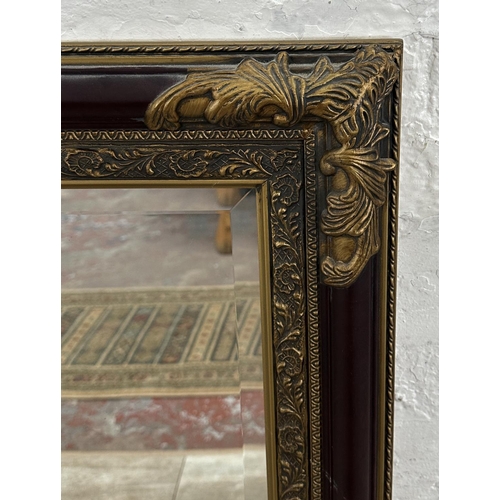 19 - A 19th century style red lacquered and gilt framed bevelled edge wall mirror - approx. 110cm x 79cm