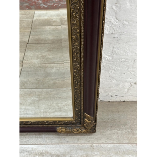 19 - A 19th century style red lacquered and gilt framed bevelled edge wall mirror - approx. 110cm x 79cm