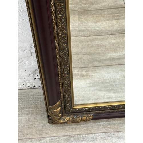 19 - A 19th century style red lacquered and gilt framed bevelled edge wall mirror - approx. 110cm x 79cm