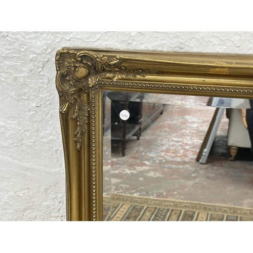 22 - A 19th century style gilt framed bevelled edge wall mirror - approx. 107cm high x 132cm wide