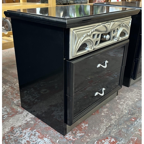 225 - A pair of modern black and silver lacquered bedside chests of drawers - approx. 55cm high x 58cm wid... 