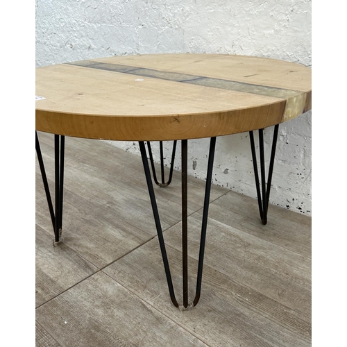 229 - A modern beech and epoxy resin circular coffee table on metal hairpin supports - approx. 44cm high x... 