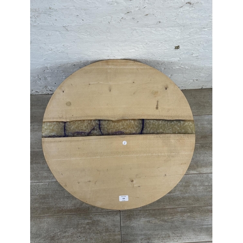 229 - A modern beech and epoxy resin circular coffee table on metal hairpin supports - approx. 44cm high x... 