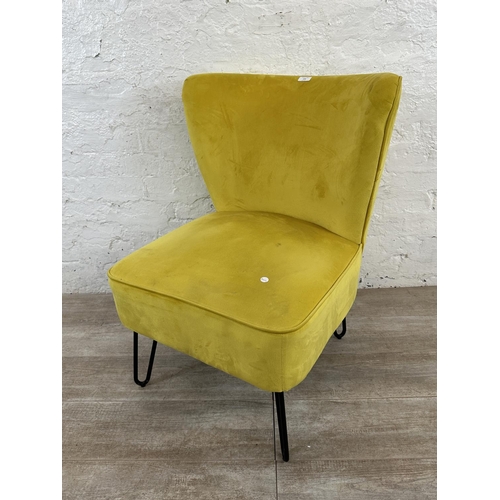 230 - A modern yellow fabric upholstered occasional chair on metal hairpin supports